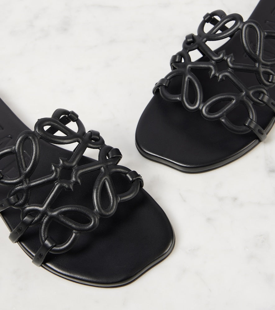 Loewe Petal Anagram Slide in Black Calfskin - three quarter
